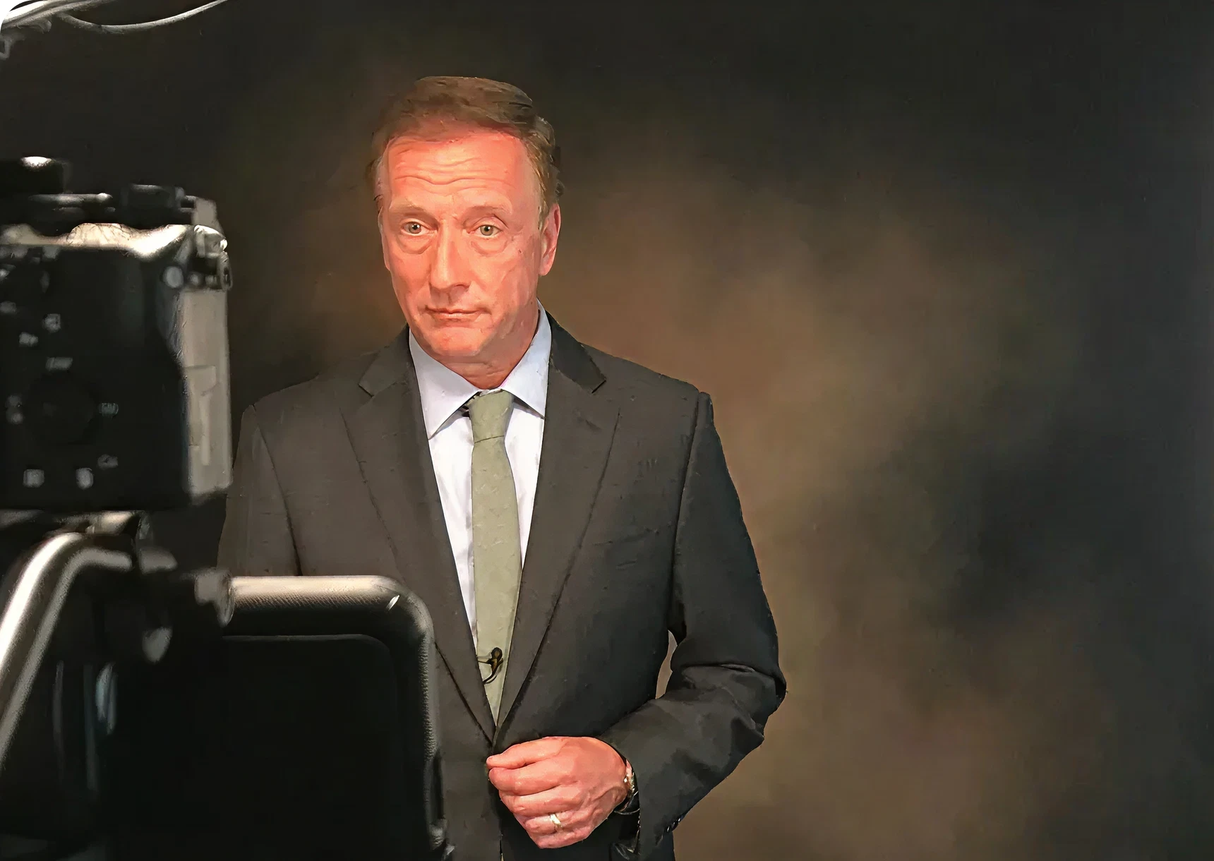 Man in suit during video recording